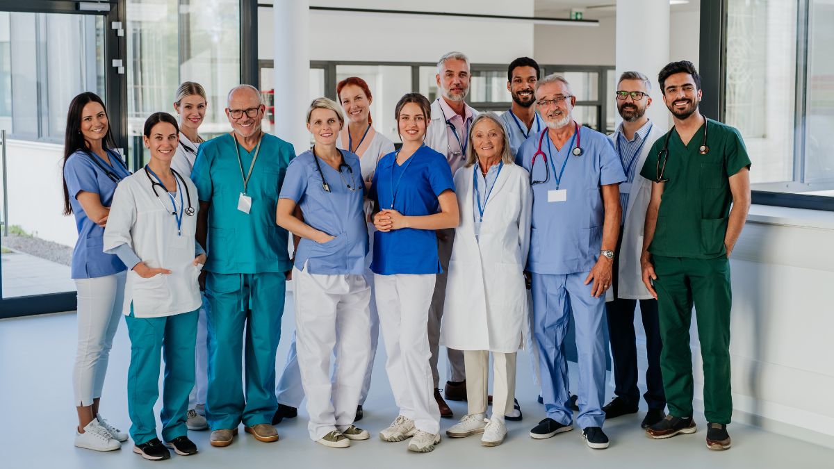 Diverse healthcare professionals working together in a modern hospital.
