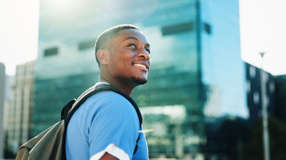 Healthcare professional considering his career options outside a modern healthcare building